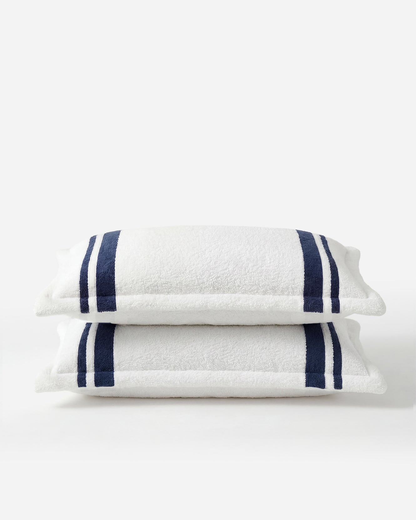 Amarena Snug Striped Sham Set folded view showing navy stripe detail and structured edge 