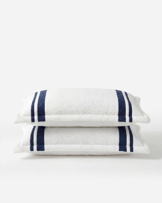 Amarena Snug Striped Sham Set folded view showing navy stripe detail and structured edge 