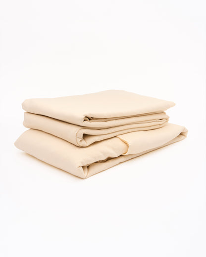 Signature Milk Fibre Sheet Set in Cream folded stack on white