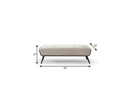 Dimension diagram of beige tufted vegan leather bench showing 58 inches wide 19 inches high and 18 inches deep with black steel legs