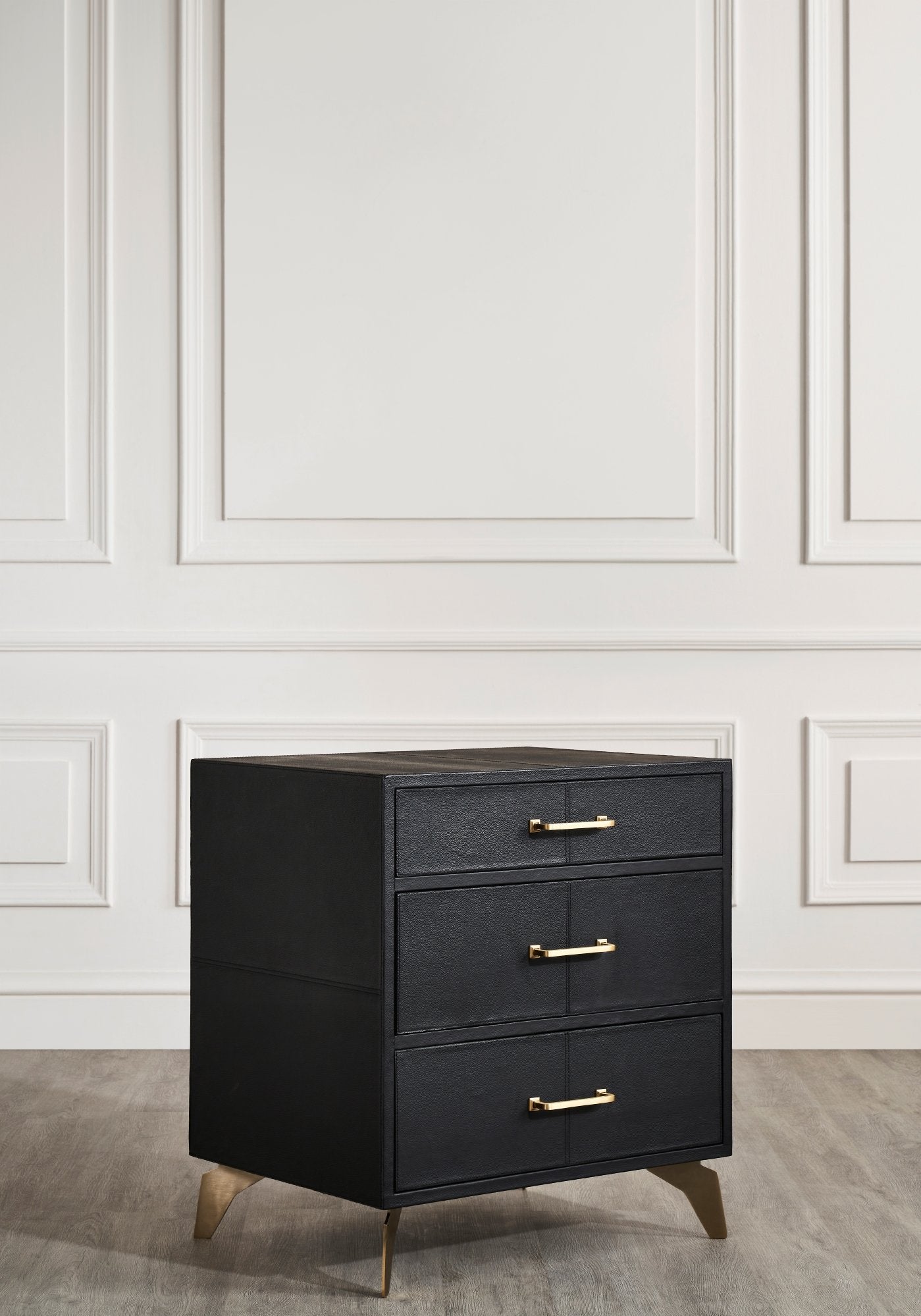 Berkeley Leather Nightstand black genuine leather texture brass handles styled white paneled wall 