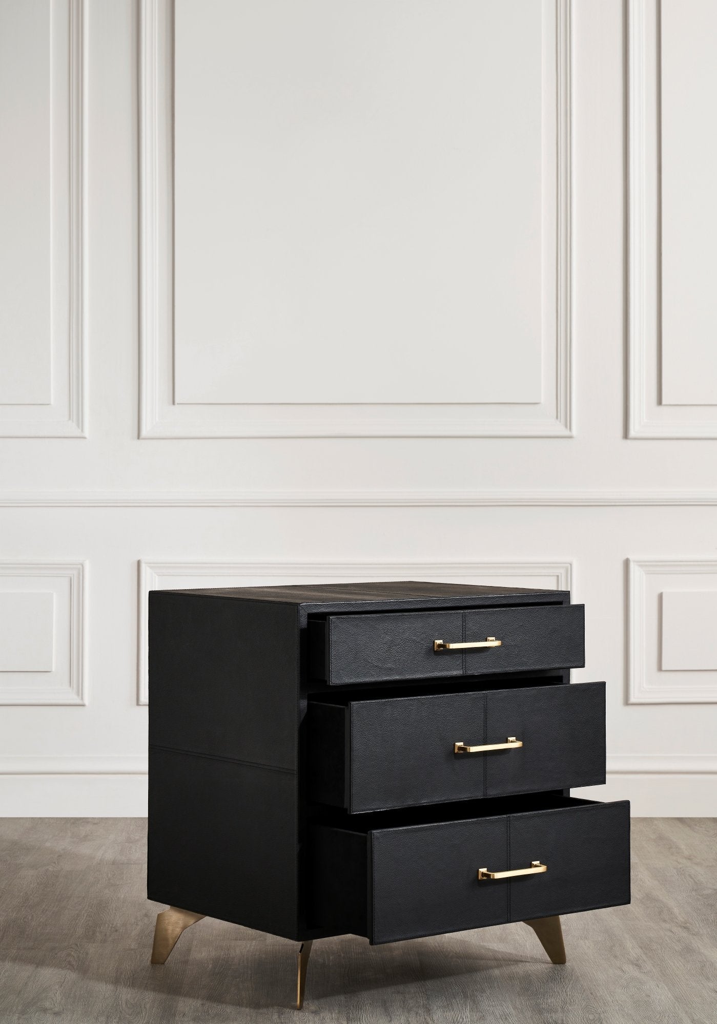 Berkeley Leather Nightstand black three drawers open soft-close brass handles white paneled wall 
