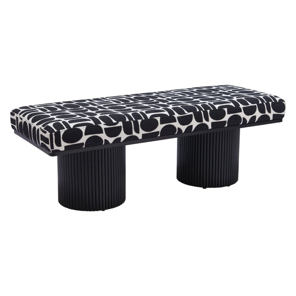 Side view of black and white geometric upholstered bench with dual ribbed black cylindrical pedestal legs on white background