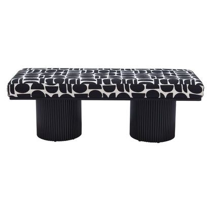 Full front view of black and white geometric upholstered bench with dual ribbed black cylindrical pedestal legs on white background