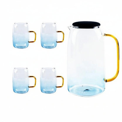 Blue gradient glass carafe with black lid and four matching cups with gold handles on white background