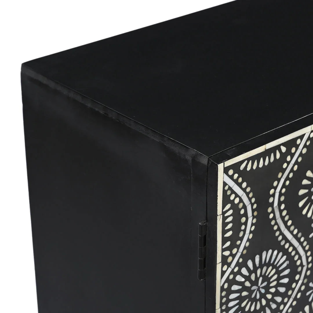 A close-up detailed view of the top corner of the Bone Inlay Storage Cabinet, highlighting the smooth black finish, durable side hinges, and precisely aligned inlay