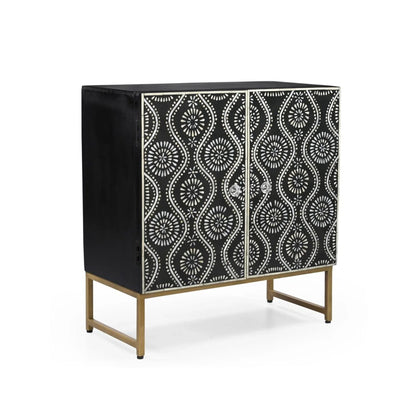 An angled side view of the Bone Inlay Storage Cabinet on a gold metal base, showcasing the contrast between the black solid wood sides and the patterned front doors.