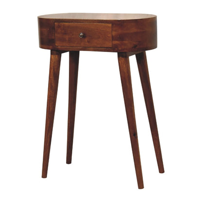 Chestnut oval solid wood console table with drawer showing oval top and splayed four-leg base from slight angle on white background