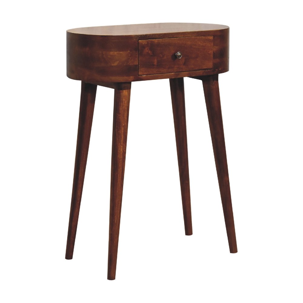 Chestnut oval solid wood console table with drawer and four splayed legs shown from three-quarter angle on white background