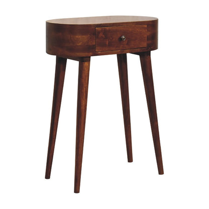 Chestnut oval solid wood console table with drawer and four splayed legs shown from three-quarter angle on white background