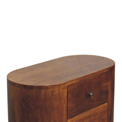 Oval top surface detail of chestnut solid wood compact cabinet showing smooth mango wood grain and softly rounded edges