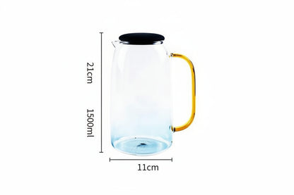 Clear glass carafe with gold handle and black lid showing 1500ml capacity and 21cm height on white background