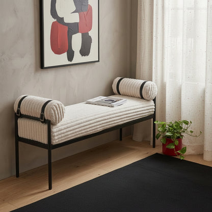 Cream corduroy upholstered bedroom bench styled in modern room with abstract wall art sheer curtains hardwood floor and potted plant