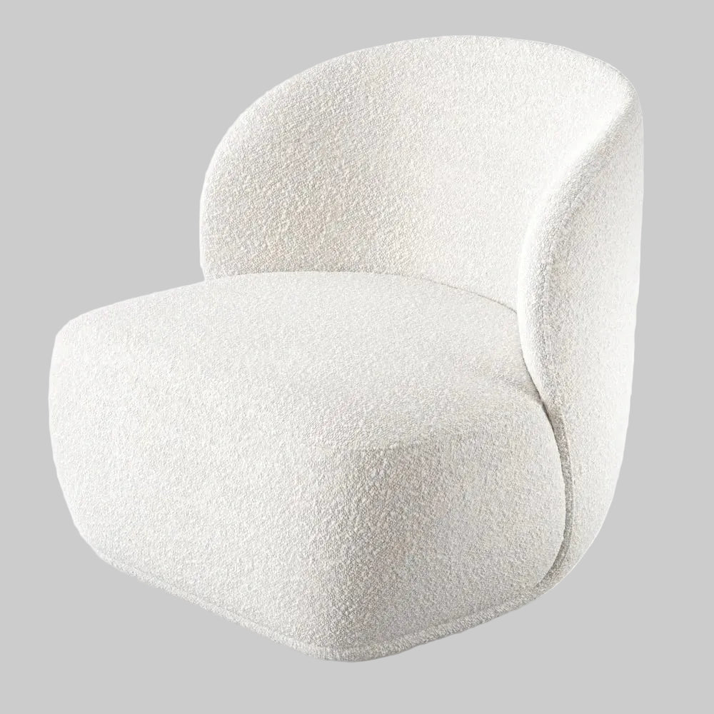 Studio shot of a white boucle barrel chair featuring a soft gray background that highlights its curved armless design and textured material.