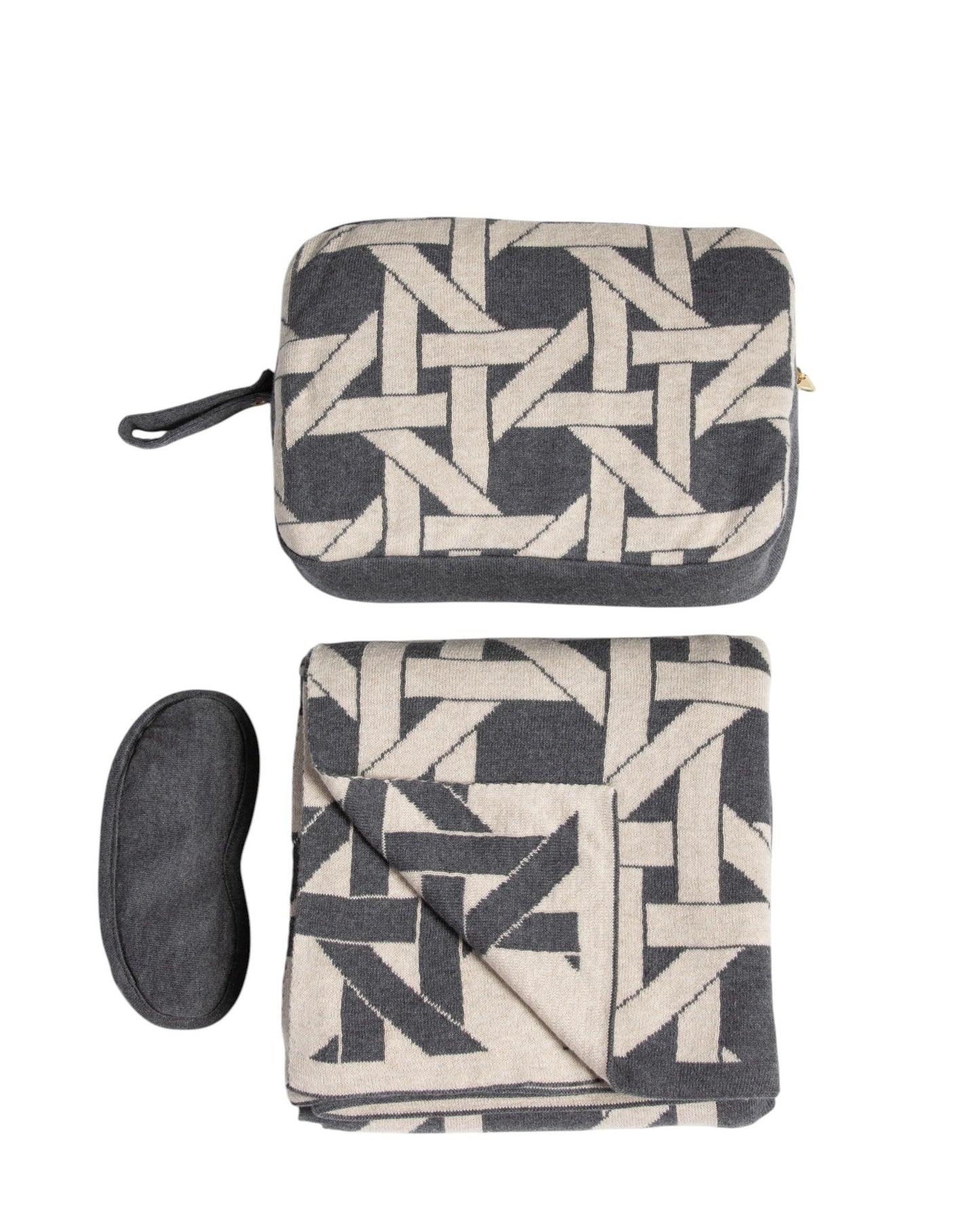Dark gray organic cotton travel blanket set with geometric pattern including folded blanket eye mask and compact pouch