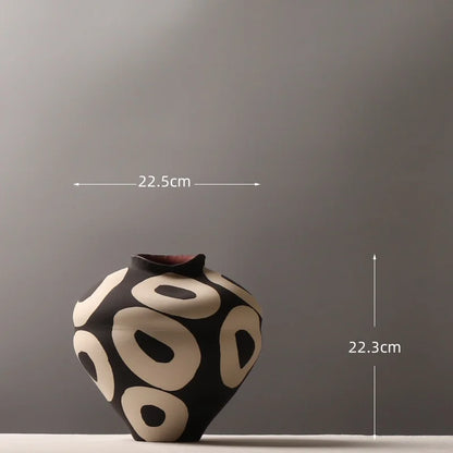 Aurelia geometric decorative vase dimension diagram showing a width of 22.5 cm and height of 22.3 cm, with light circular patterns and an irregular curved rim.