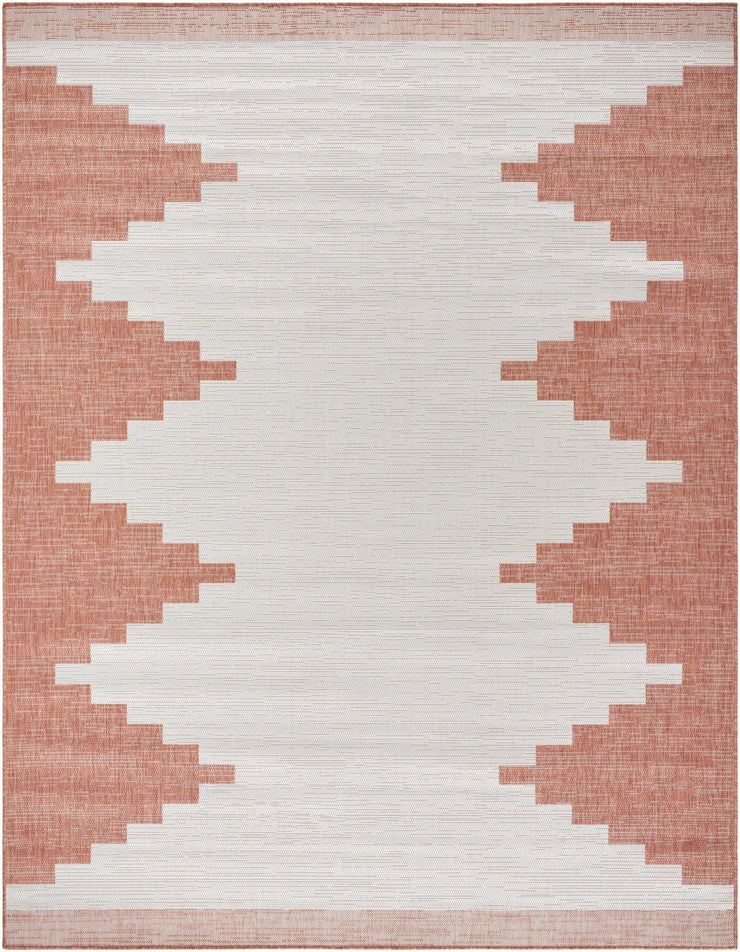 Hauteloom Djugun Peach Fuzz indoor/outdoor rug with Aztec geometric pattern in peach and off-white for patio