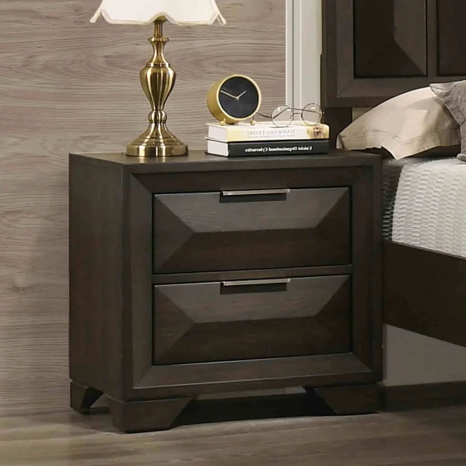 Close-up of a two-drawer espresso nightstand featuring architectural faceted panels and sleek horizontal hardware.