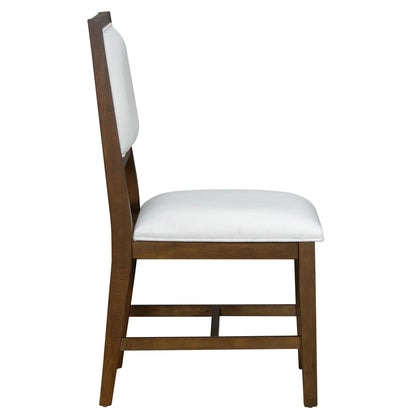 Side view of wooden dining chair with white cushioned seat and backrest