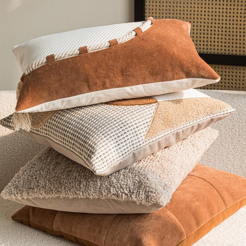 Stacked wabi-sabi cotton-linen pillow covers in caramel, off-white and beige showing multiple textures and artisan finishes