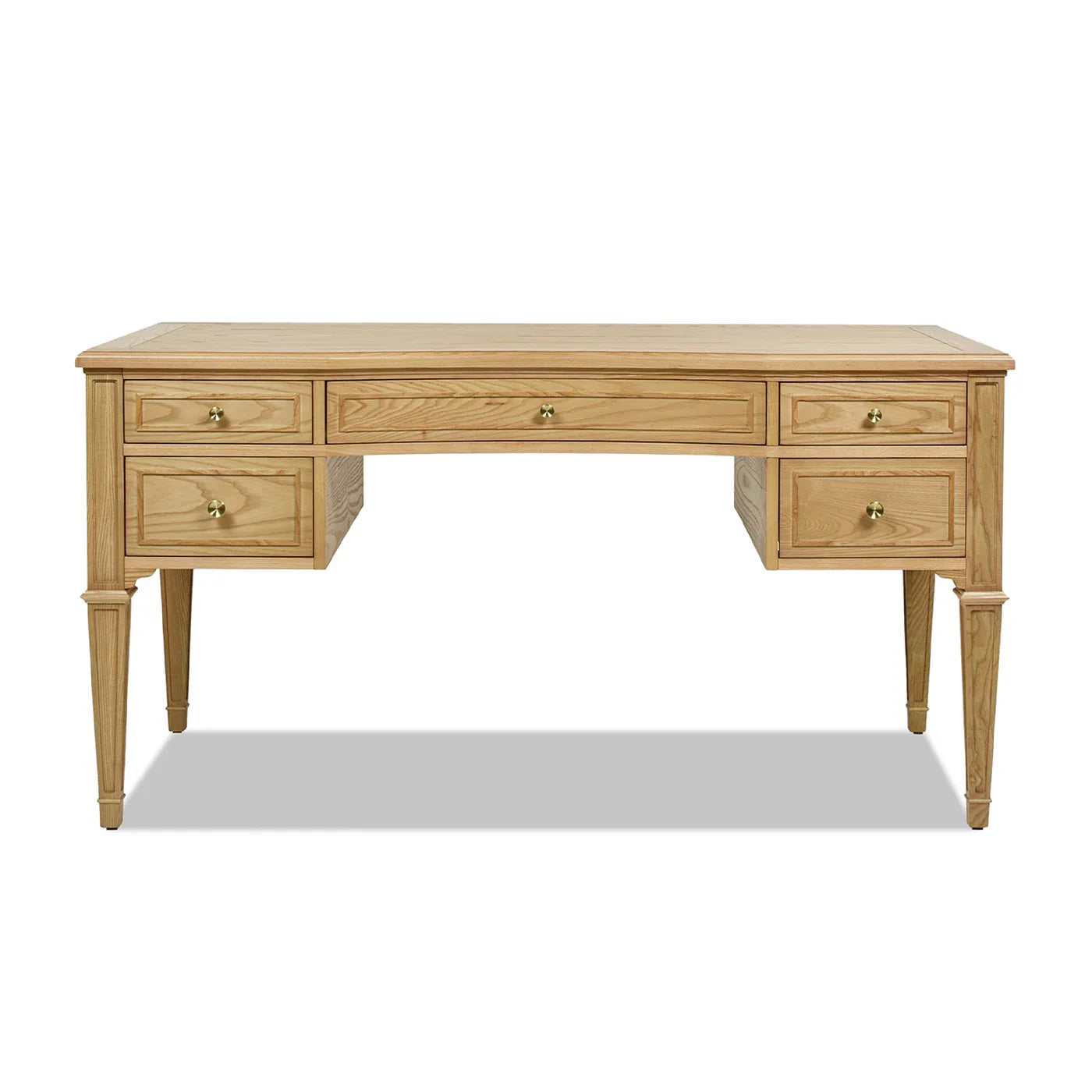 Low-angle view of an ash wood executive desk highlighting the five-drawer storage and sleek gold hardware for a premium home workspace.