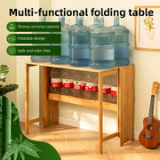 Brown bamboo folding desk holding multiple water bottles, showcasing strong carrying capacity and foldable design.