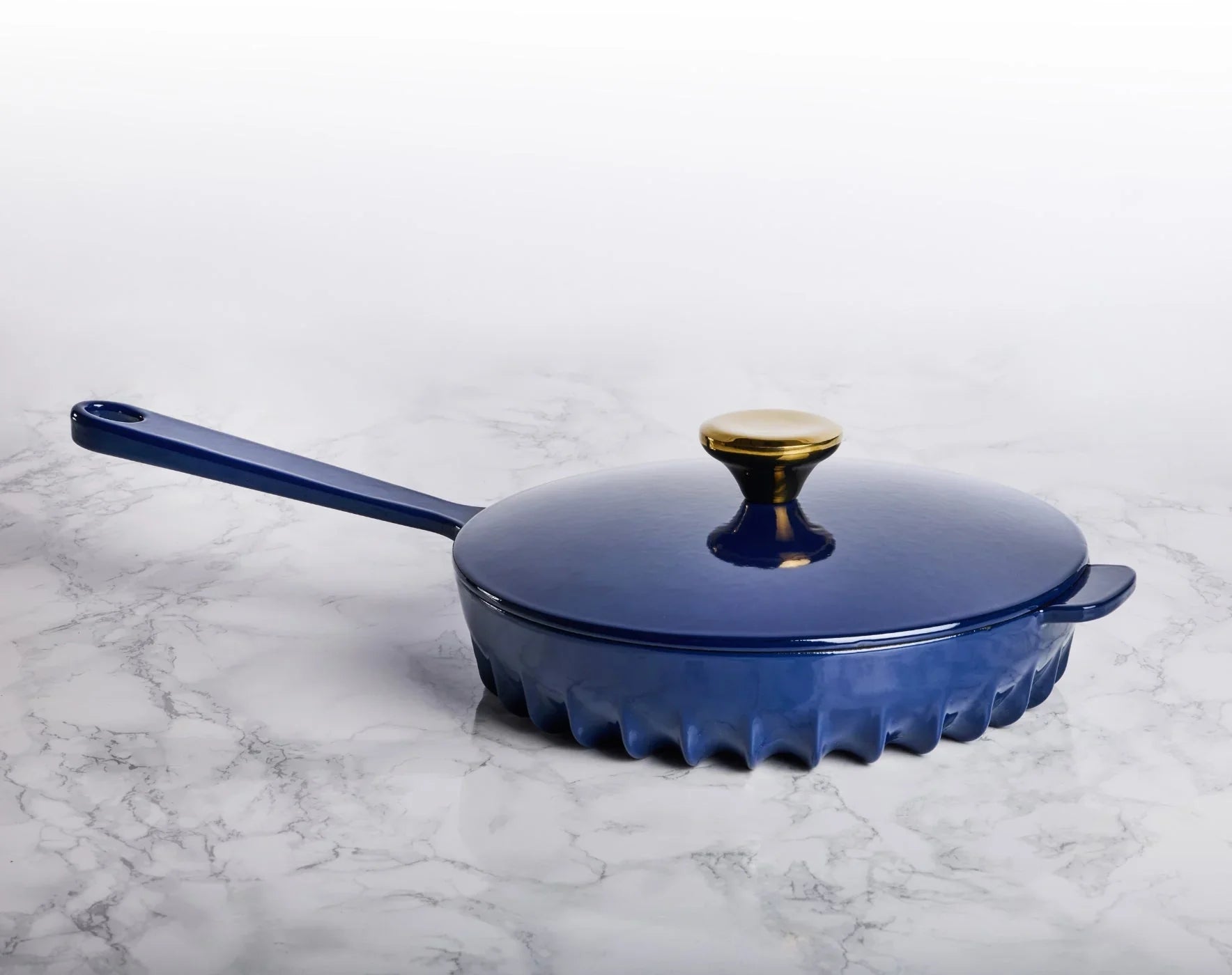 Top view of the FIREUP Oxford Blue enameled cast iron skillet with matching lid and easy-grip handles.