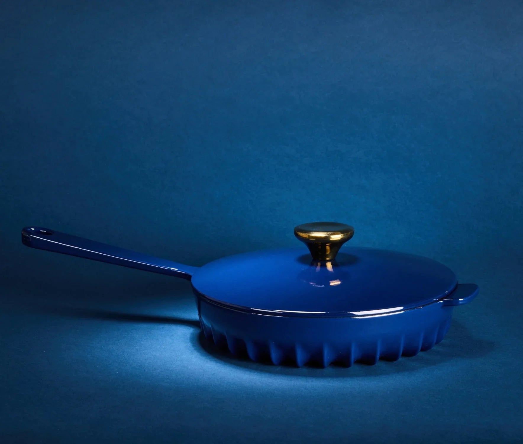 The FIREUP Oxford Blue cast iron skillet baking in an oven to demonstrate its superior heat distribution.