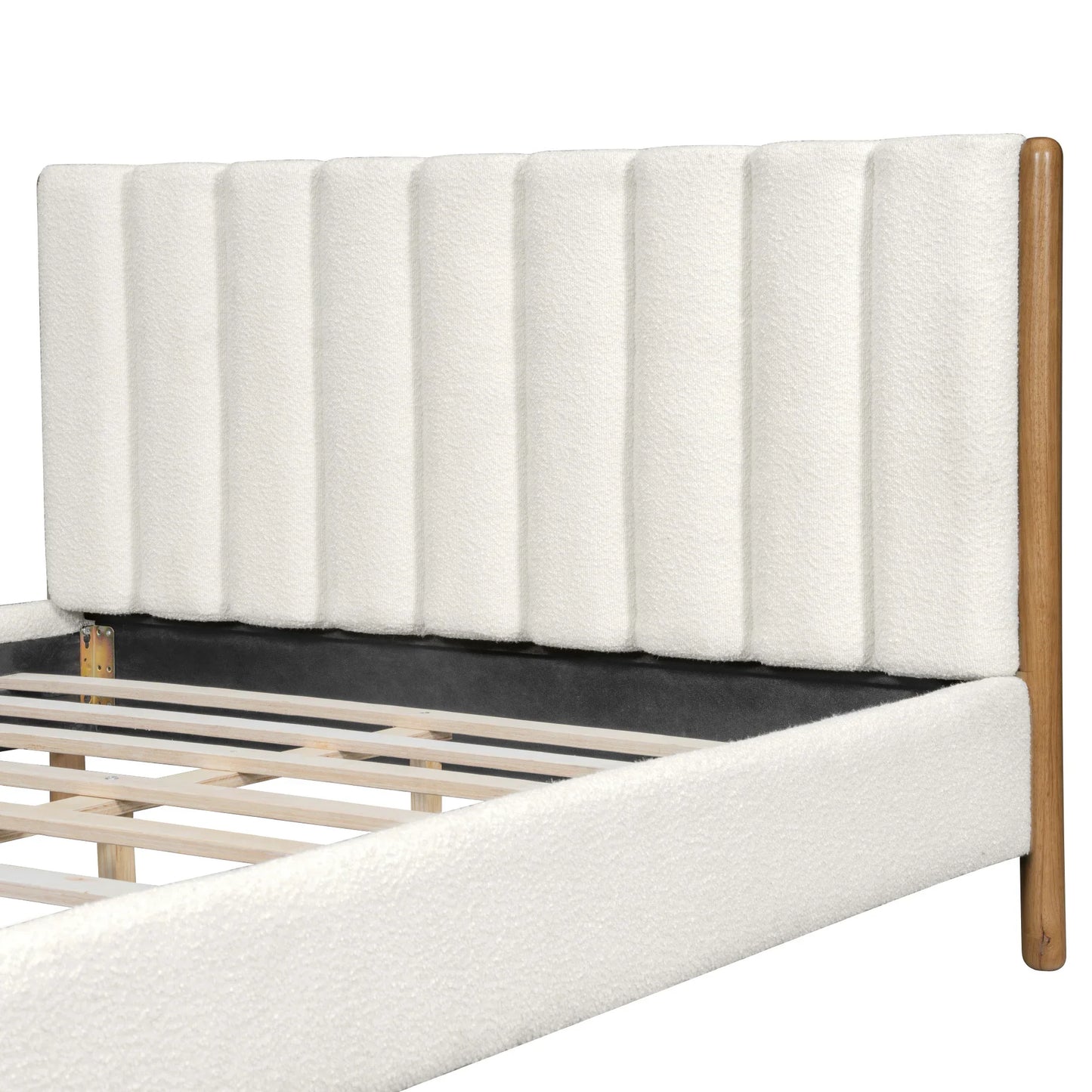 Close-up of white bouclé vertical panel headboard texture and plush padding detail with natural rubberwood leg on white studio background

