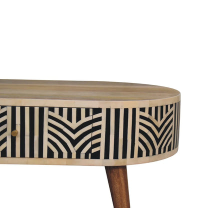 Edessa bone inlay coffee table close-up detail showing intricate geometric black and white bone inlay drawer front with brass pull and natural oak-tone mango wood tabletop edge

