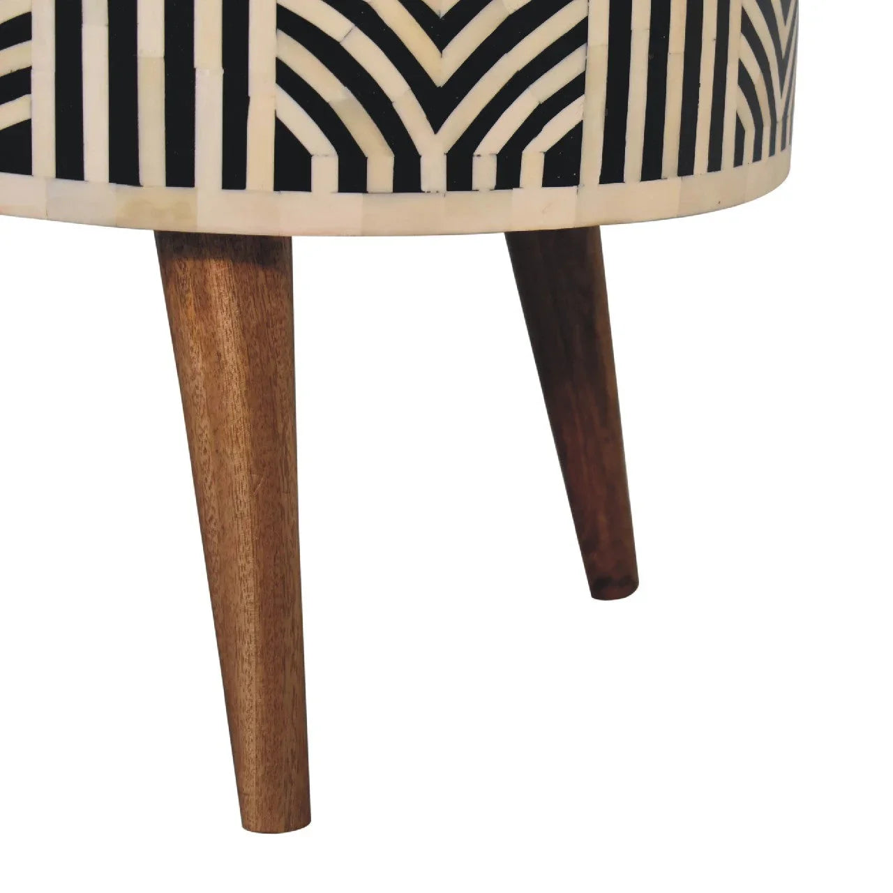 Edessa bone inlay coffee table close-up of tapered solid mango wood Nordic-style legs with geometric black and white bone inlay base on white background

