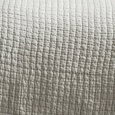 Malibu Mist silk coverlet showing pale gray fabric with closely spaced square quilting and softly puckered texture