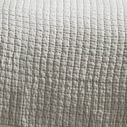 Malibu Mist silk coverlet showing pale gray fabric with closely spaced square quilting and softly puckered texture