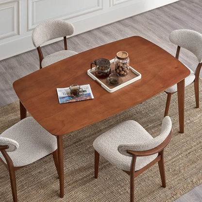 Cherry Scandinavian wood dining set overhead view with four bouclé chairs coffee service tray and magazine on jute rug

