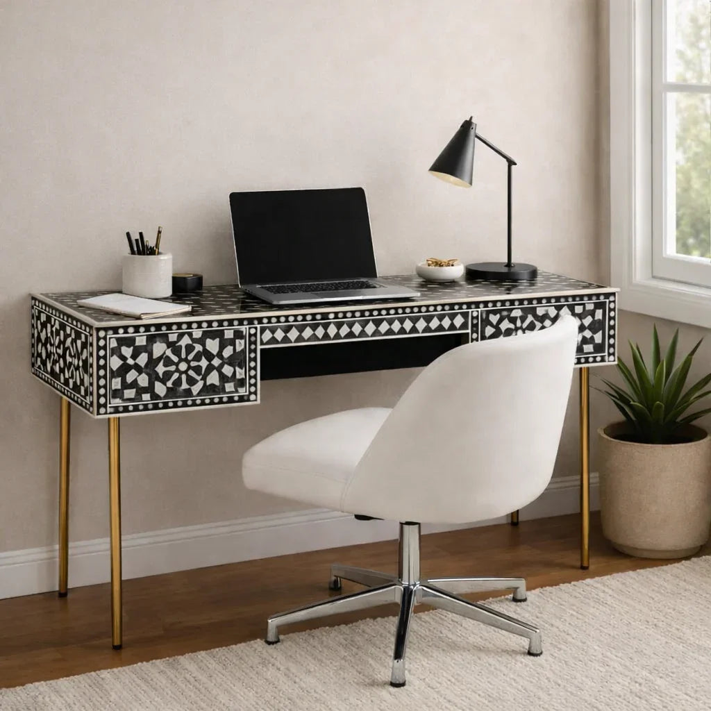 Black and white bone inlay console desk styled as a writing desk in a modern home office with gold legs