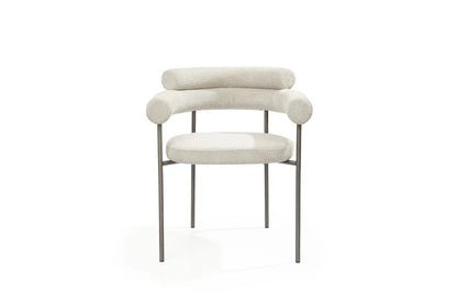 Light gray boucle dining arm chairs featuring a unique open back design and durable gunmetal stainless steel frames.