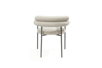 Rear view of light gray boucle dining arm chairs showcasing the durable stainless steel frame and curved back.