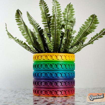Orion hexagonal plant pot in Rainbow, multicolor 3D printed planter on a white background