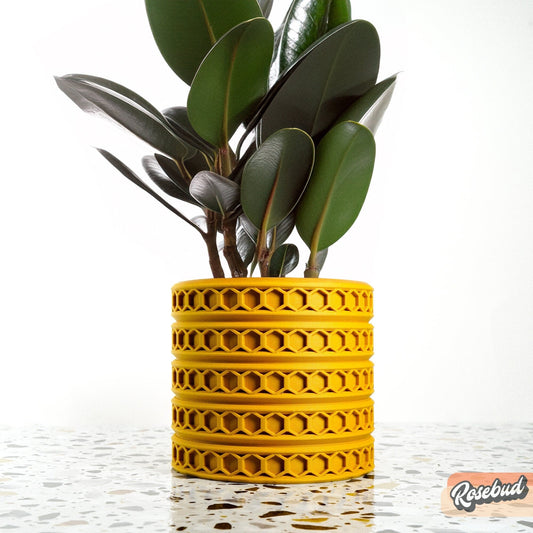 Orion hexagonal plant pot in Mustard, 3D printed indoor planter on a white background