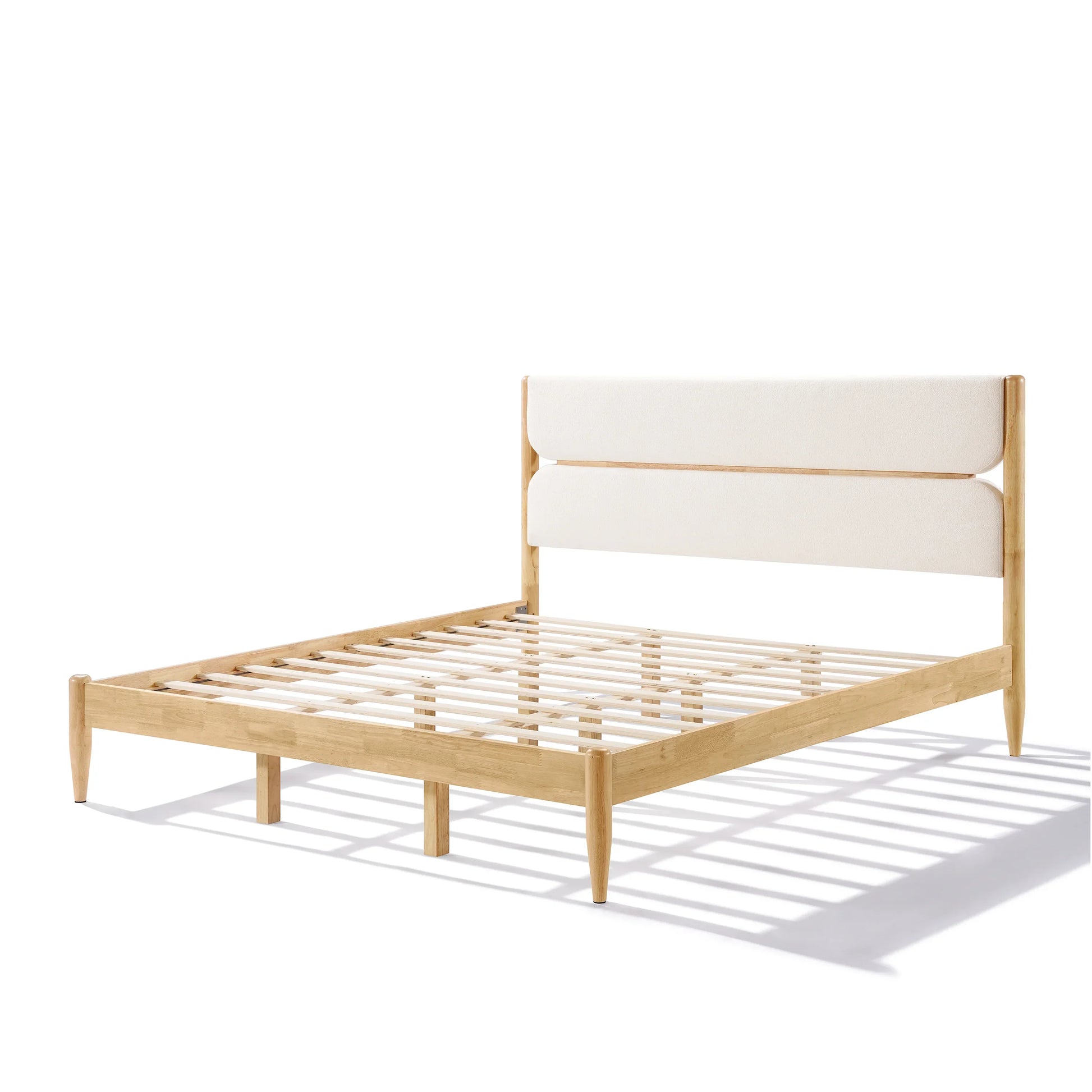 King Platform Bed with a Durable Rubberwood Frame in a light natural finish, featuring a high ivory upholstered headboard and a low-profile integrated slat system.