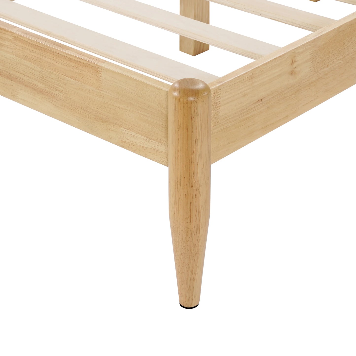  A close-up view of a Durable Rubberwood Frame corner showcasing the sleek, tapered solid wood leg and precise joinery of a King Platform Bed.