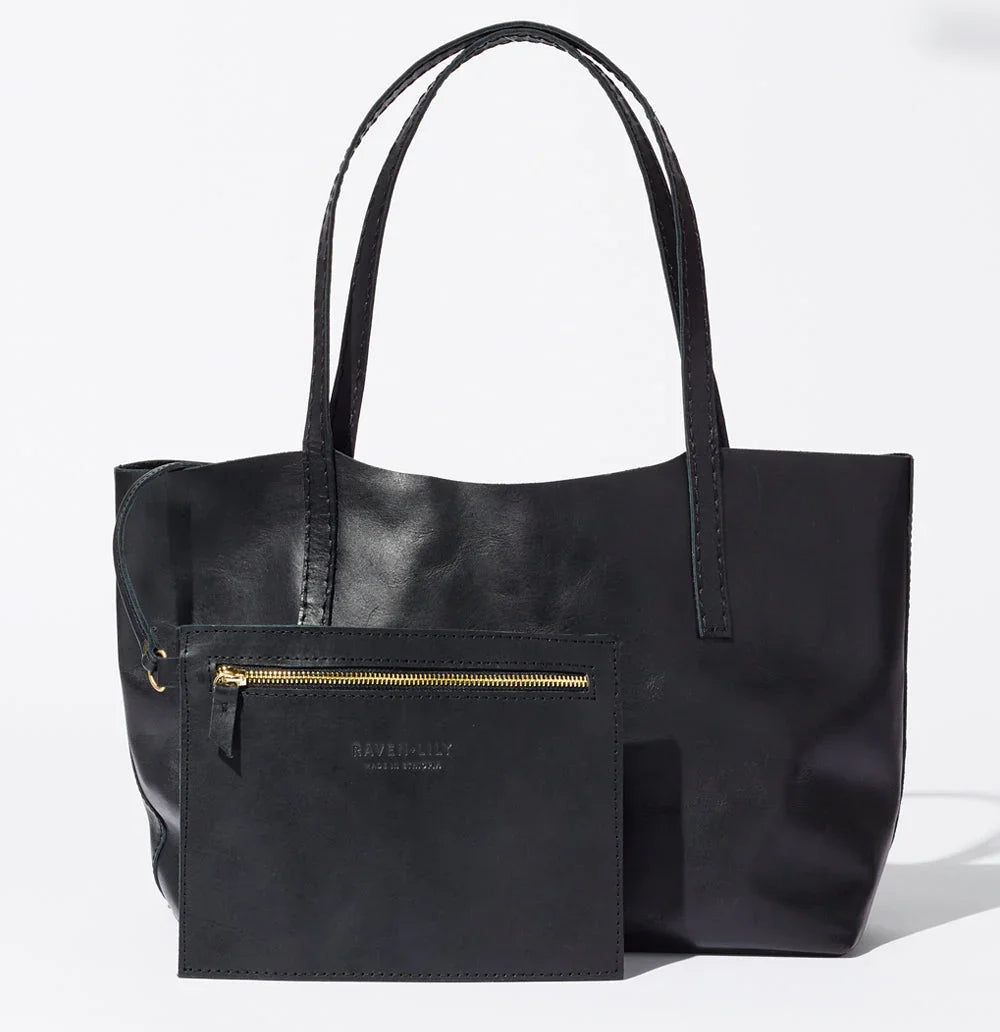 Lady Bird Carryall Black natural leather front view with interior zip pouch gold hardware long shoulder straps white background