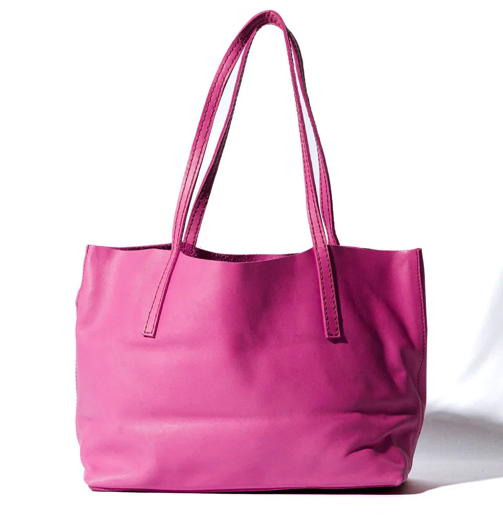Lady Bird Carryall Wisteria natural leather angled front view long shoulder straps structured silhouette spacious body white background