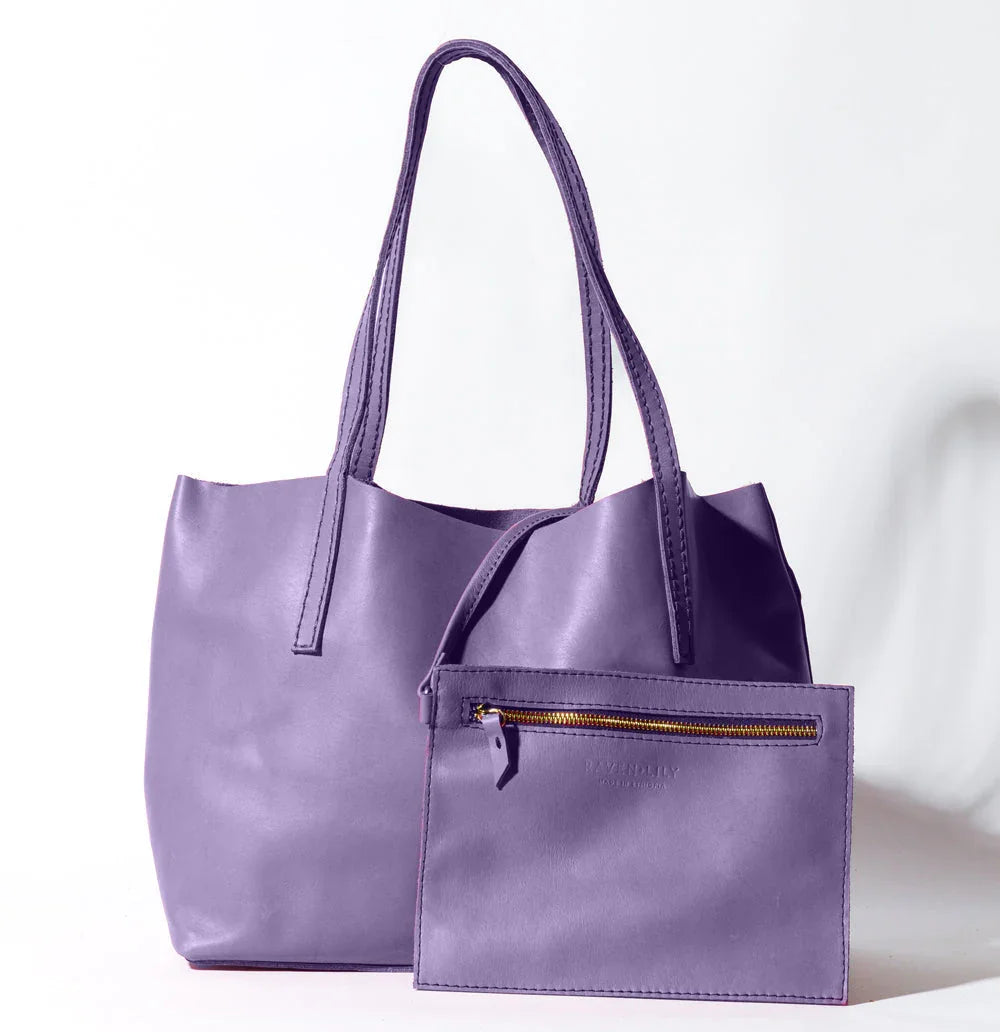 Lady Bird Carryall Wisteria natural leather front view with interior zip pouch long shoulder straps white background
