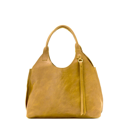Lady Bird Tote Dijon natural leather front view white background short top handles brass o-ring tassel detail retro silhouette

