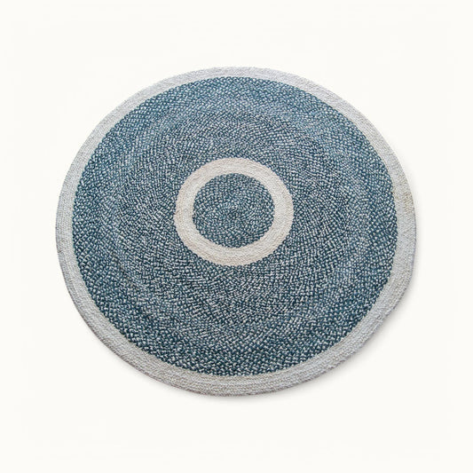 Handwoven round sisal rug black variant with cream circle ring motif and light grey border on white background