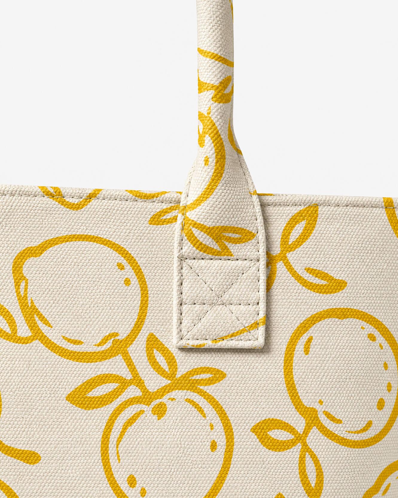 Lemone Tote Bag lemon print pattern detail on structured cotton exterior ochre and white