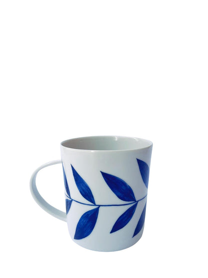 Lhasa porcelain mug with blue botanical leaf glaze tapered silhouette handcrafted Limoges
