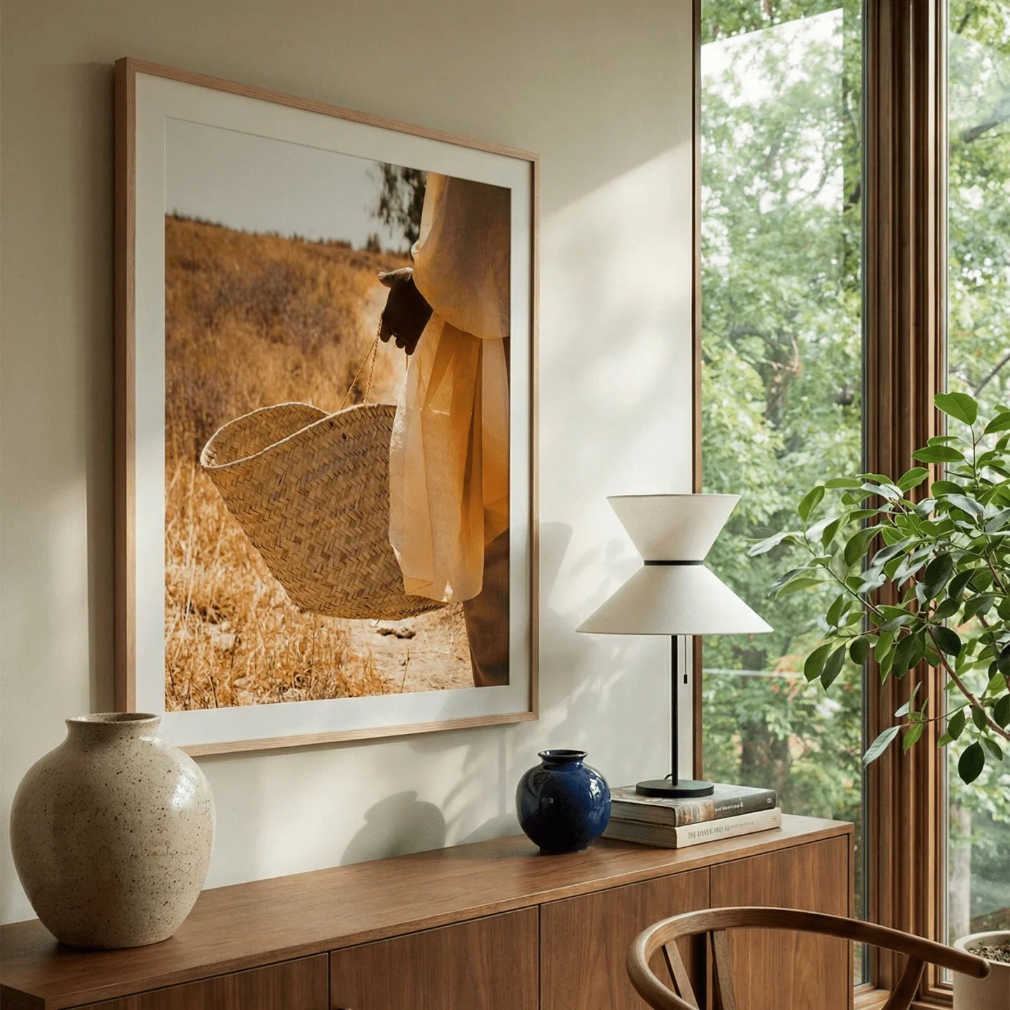 Elegant lifestyle photography framed in a minimalist gallery artwork layout above a modern wooden console table