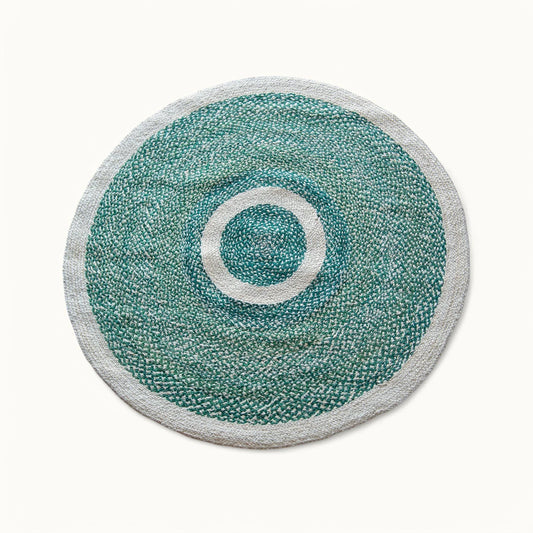 Handwoven medium round sisal rug forest green variant with cream circle ring motif and light grey border on white background